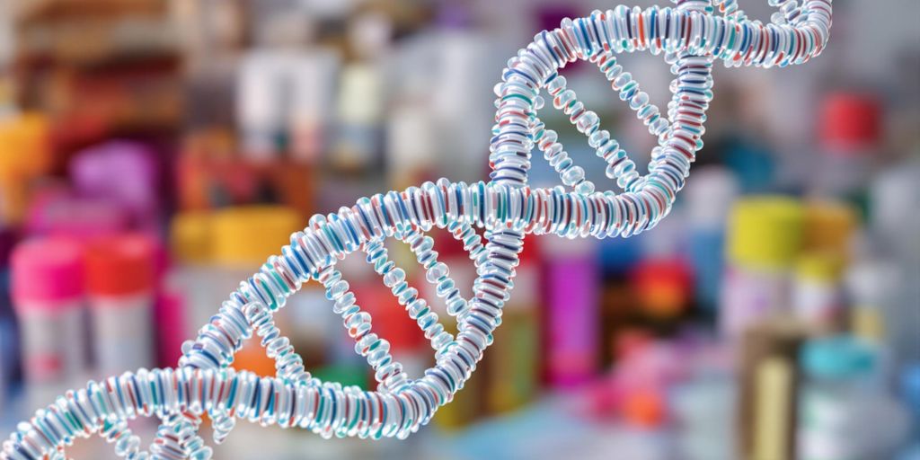 A 3D rendering of a DNA double helix with intertwining strands in blue and red evokes the precision of a CVS paternity test. The blurred, colorful background hints at a laboratory setting filled with various containers and equipment.